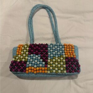 Elegant Blue and Purple Shoulder Bag with Sleek Design